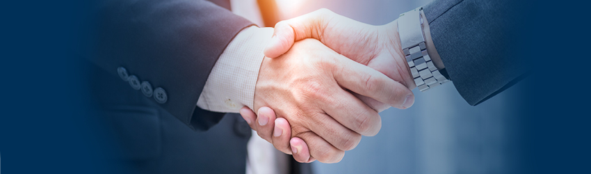 Closeup of two business men shaking hands